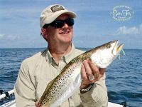 Ken Butterfield with a large Spotted Sea Trout on fly fishing with Captain Russ Shirley of Salty Fly Charters.