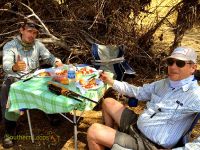 Enjoying lunch on the Alumine River.