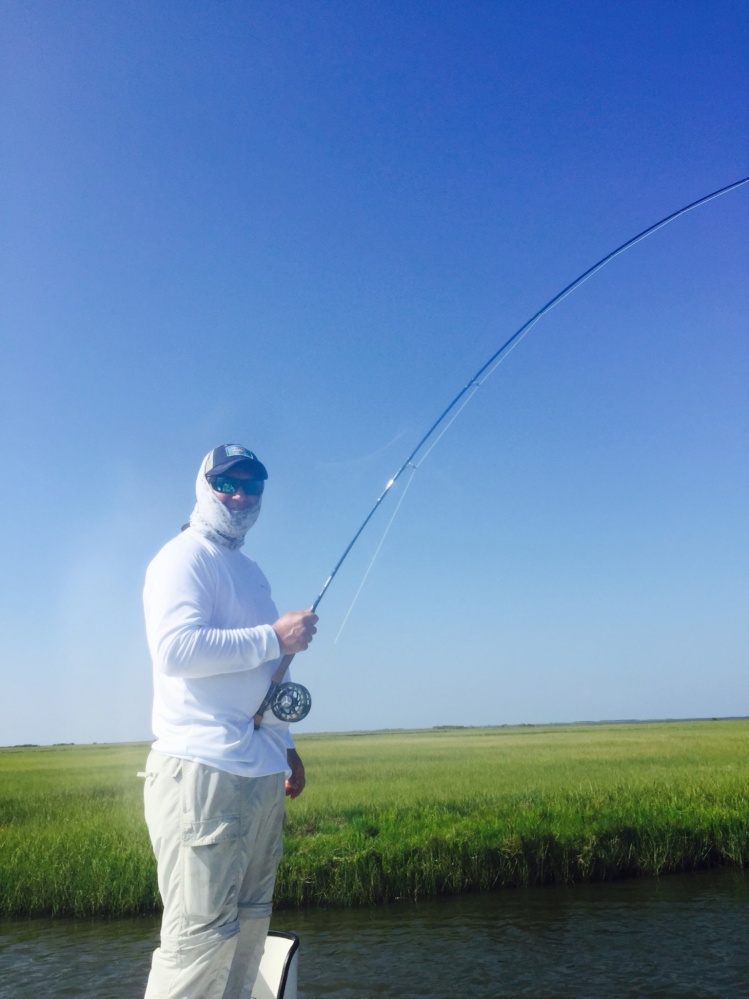 Dad fighting his first Redfish on the Fly. He's hooked!!