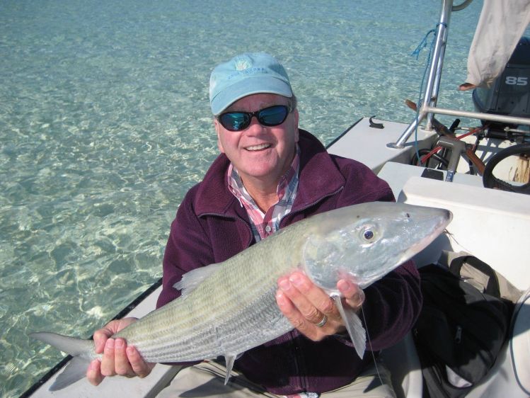 Kevin with one of many big bonefish he caught with Whitney .
