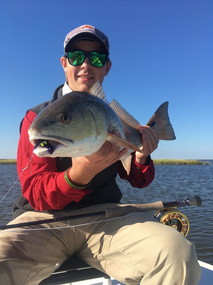 Louisiana red with a mouthful of fly.