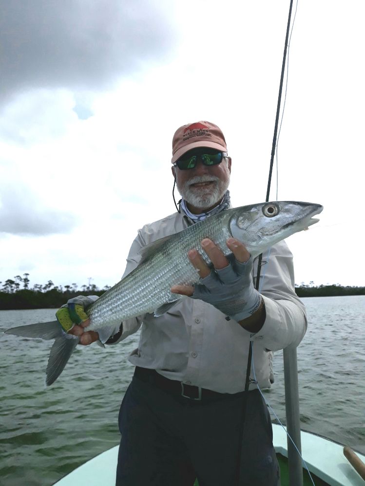 My friend Swanson Graves with a nice bonefish on the flats East Grand Bahama Bahamas with Whitney Rolle.