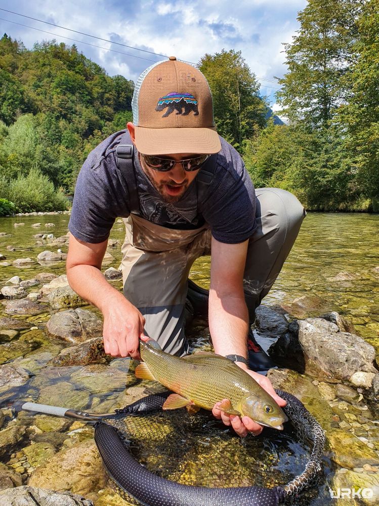 Jonny with his beautiful grayling on a dry fly